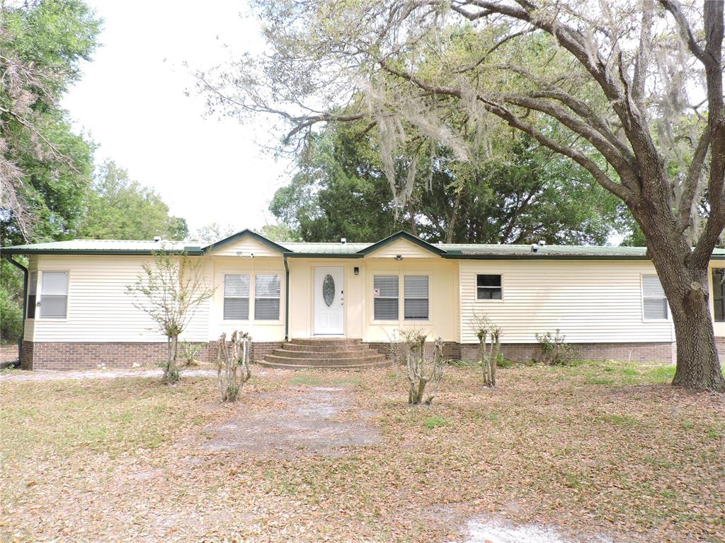 294 Tiger Lake Road Lake Wales, FL 33898 - Photo 3 of 56 front view of a house with a yard