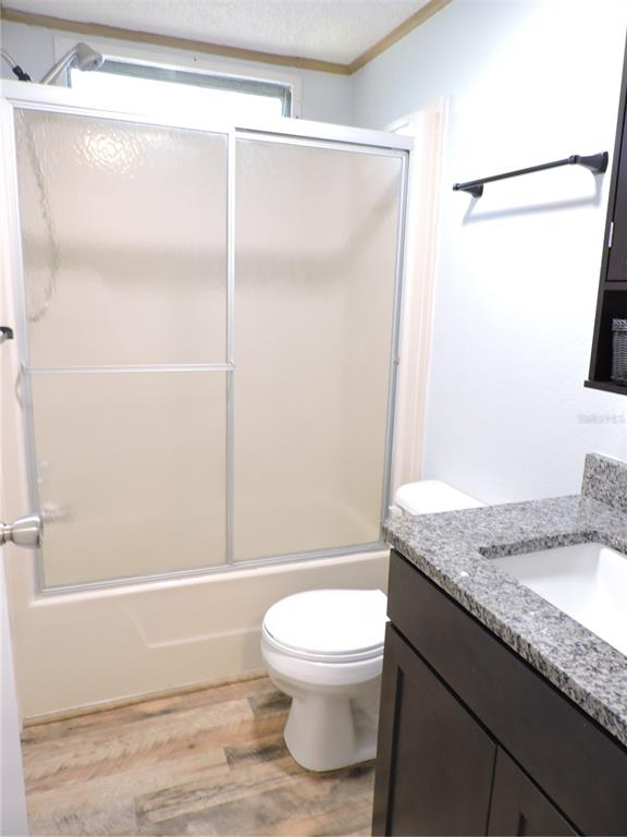 294 Tiger Lake Road Lake Wales, FL 33898 - Photo 33 of 56 a bathroom with a granite countertop sink toilet and shower