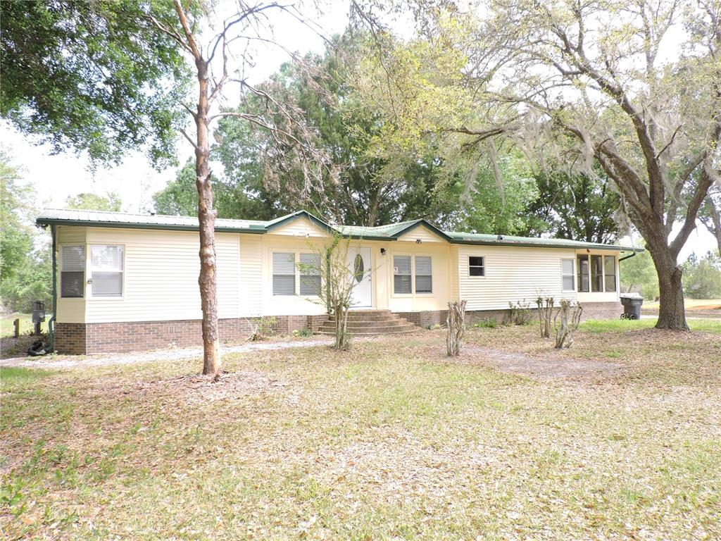 294 Tiger Lake Road Lake Wales, FL 33898 - Photo 4 of 56 front view of a house with a yard