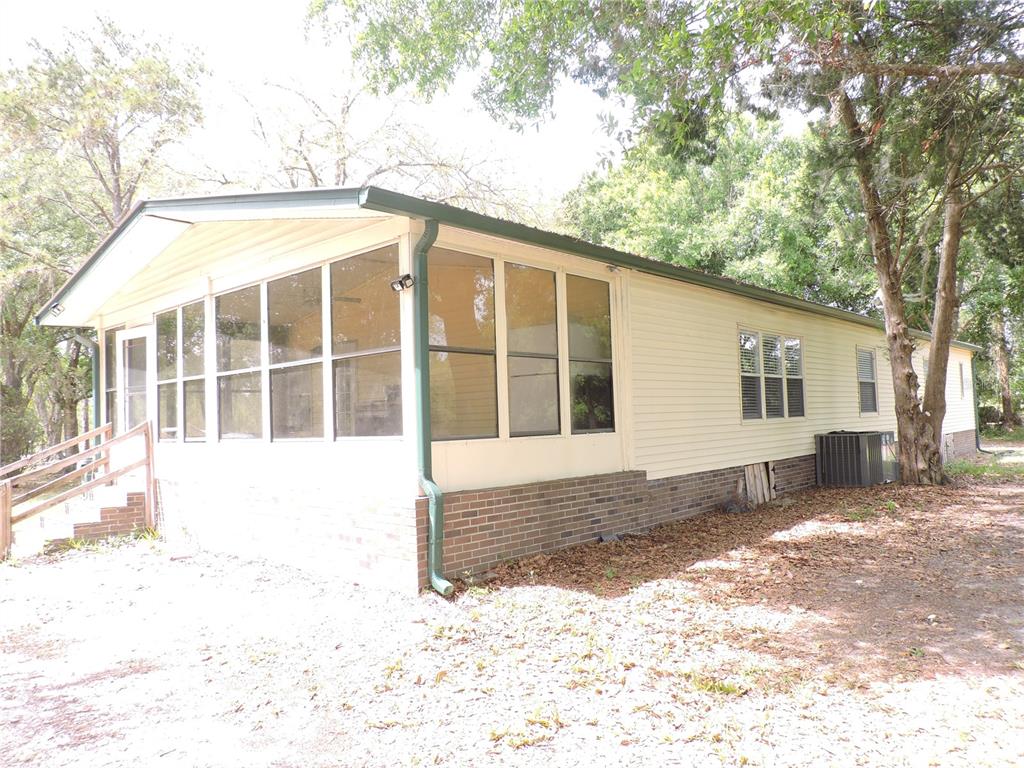 294 Tiger Lake Road Lake Wales, FL 33898 - Photo 43 of 56 a front view of a house with a yard