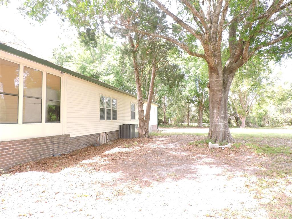 294 Tiger Lake Road Lake Wales, FL 33898 - Photo 5 of 56 a view of a house with a yard covered in snow