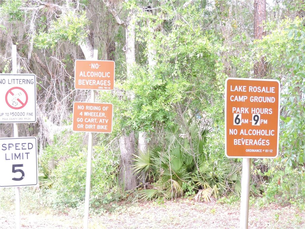 294 Tiger Lake Road Lake Wales, FL 33898 - Photo 51 of 56 a sign that is on a pole on a road