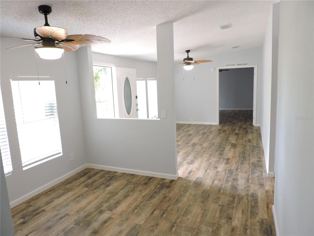 294 Tiger Lake Road Lake Wales, FL 33898 - Photo 6 of 56 wooden floor in an empty room with a window