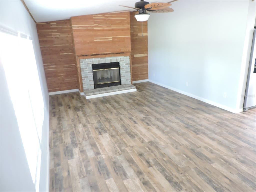 294 Tiger Lake Road Lake Wales, FL 33898 - Photo 10 of 56 a view of an empty room with a fireplace