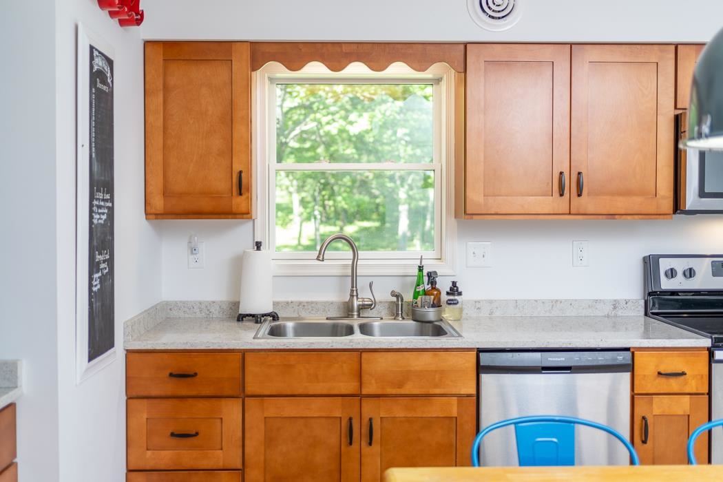 471 Shirey Road Swoope, VA 24479 - Photo 28 of 75 a kitchen with stainless steel appliances granite countertop a sink and a window