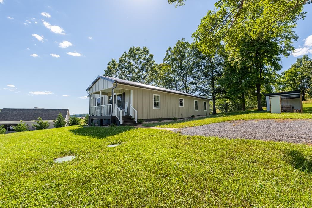 471 Shirey Road Swoope, VA 24479 - Photo 65 of 75 a view of a house with swimming pool and a yard