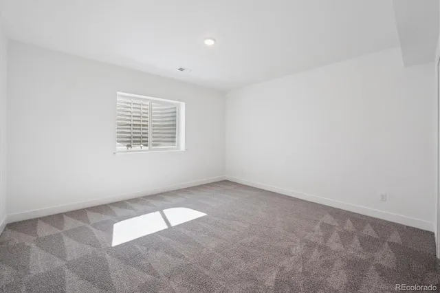 a bathroom with a sink a toilet a shower and a mirror