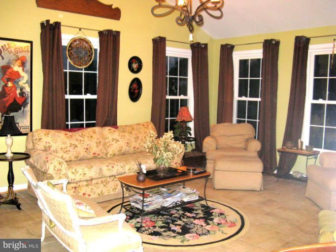 310 Greenwood Road Linthicum, MD 21090 - Photo 11 of 26 a view of a dining room with furniture and chandelier