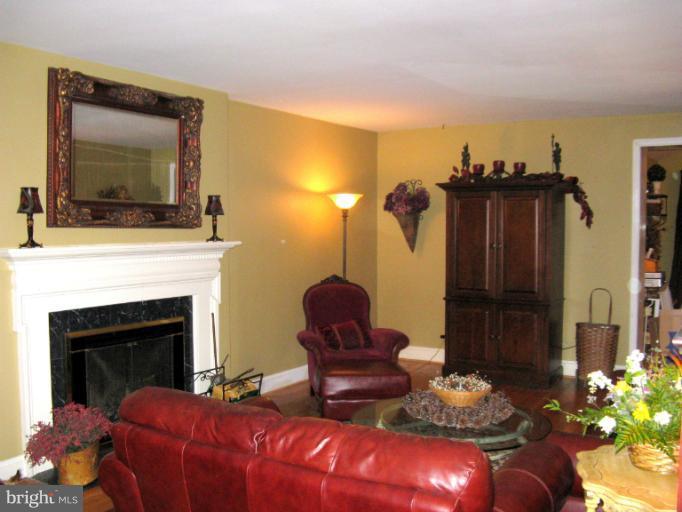 310 Greenwood Road Linthicum, MD 21090 - Photo 12 of 26 a living room with furniture and a fireplace