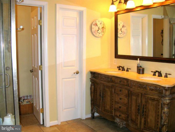 310 Greenwood Road Linthicum, MD 21090 - Photo 16 of 26 a bathroom with a sink and a mirror