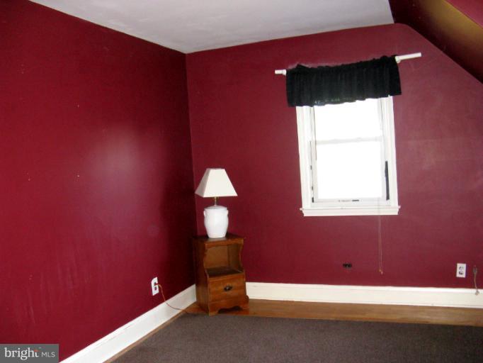 310 Greenwood Road Linthicum, MD 21090 - Photo 20 of 26 a room with a bed and a window