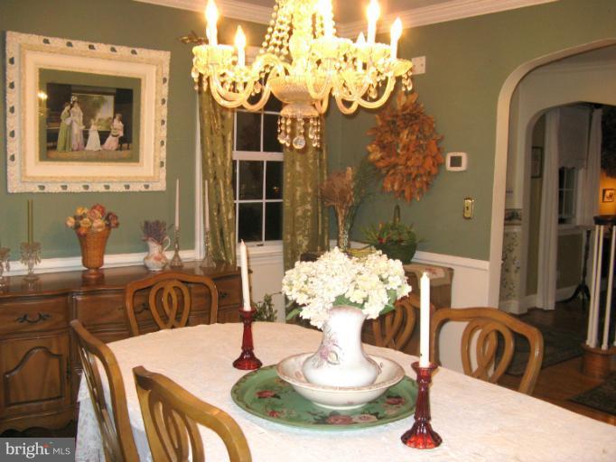 310 Greenwood Road Linthicum, MD 21090 - Photo 8 of 26 a dining room with furniture and chandelier
