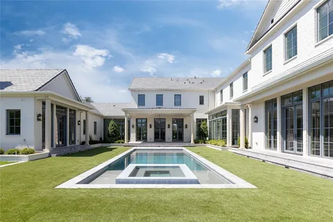 a view of a house with swimming pool and porch