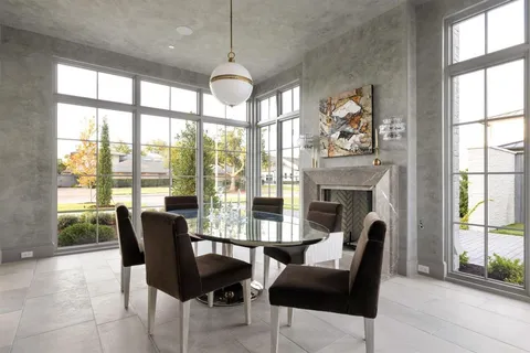 a bedroom with furniture and a fireplace