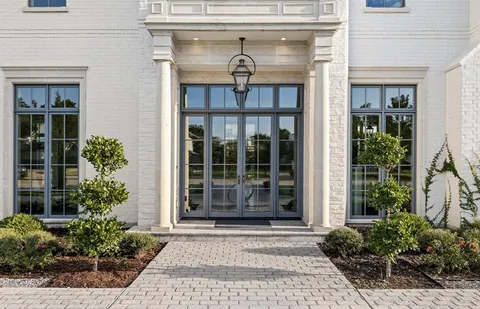a bedroom with a bed and a mirror