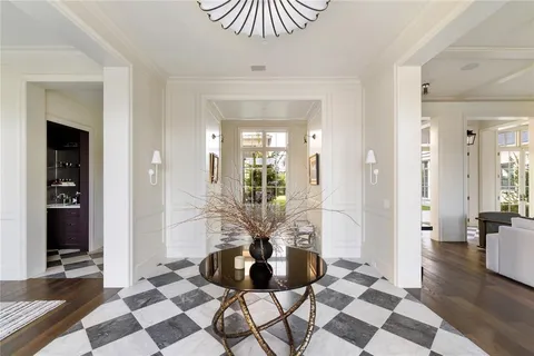 a living room with furniture large window and fireplace