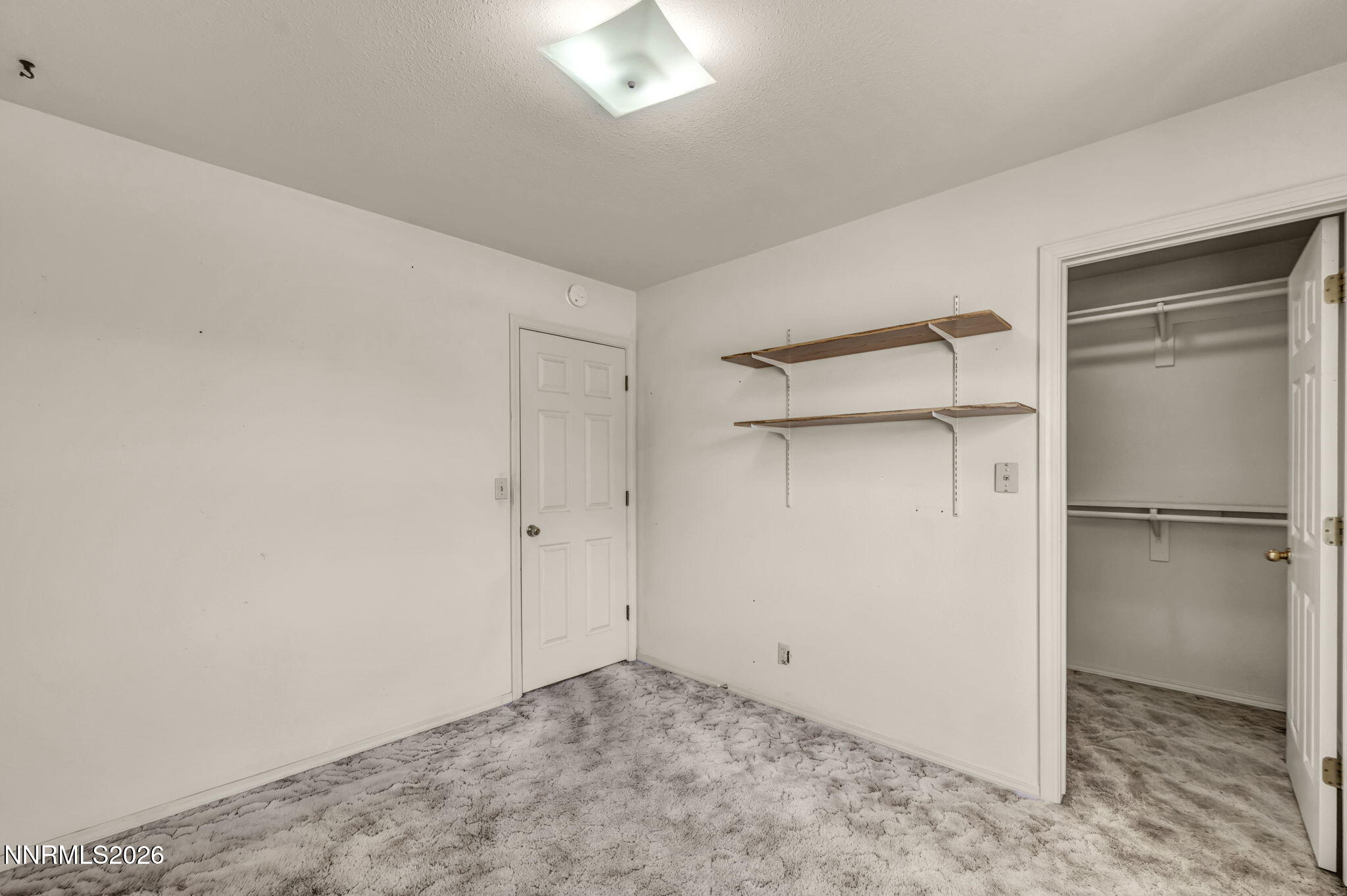 692 Lassen Way Gardnerville, NV 89460 - Photo 25 of 34 a view of a room with a refrigerator in it