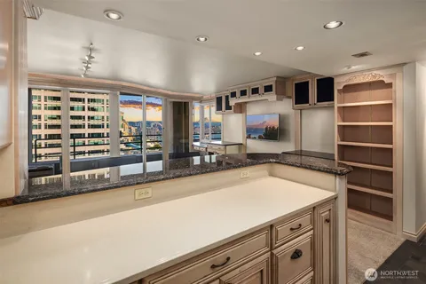 a kitchen with a refrigerator and a sink