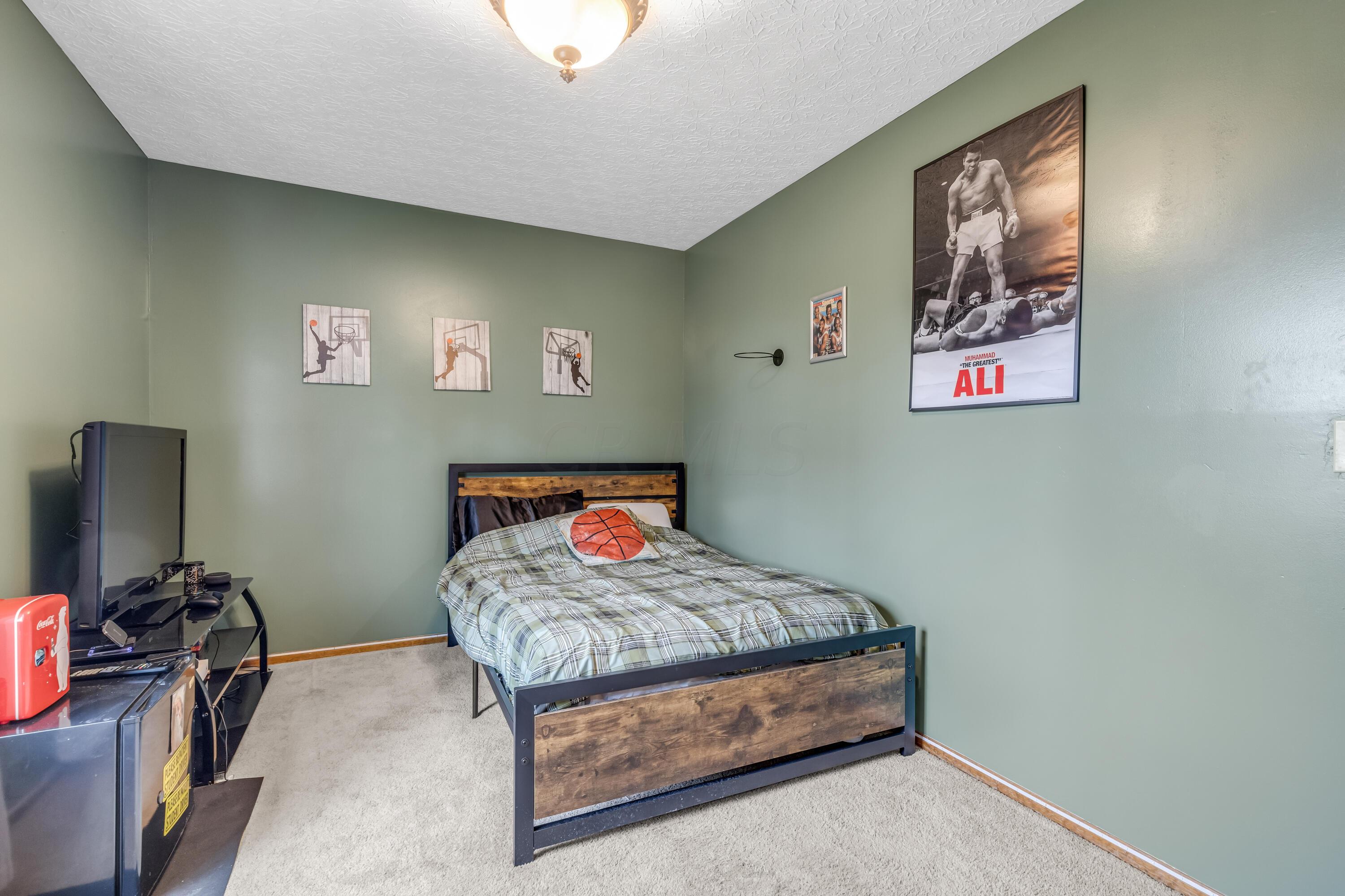 435 Emory Street Gahanna, OH 43230 - Photo 33 of 54 • Light sand carpet
• Olive painted walls
• Ceiling light
• Closet with double
sliding doors
• Drapes