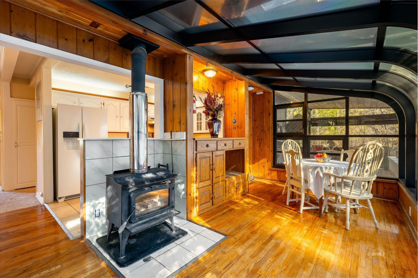 52805 Idyllmont Road Idyllwild, CA 92549 - Photo 12 of 53 a view of a dining room with furniture a chandelier and wooden floor