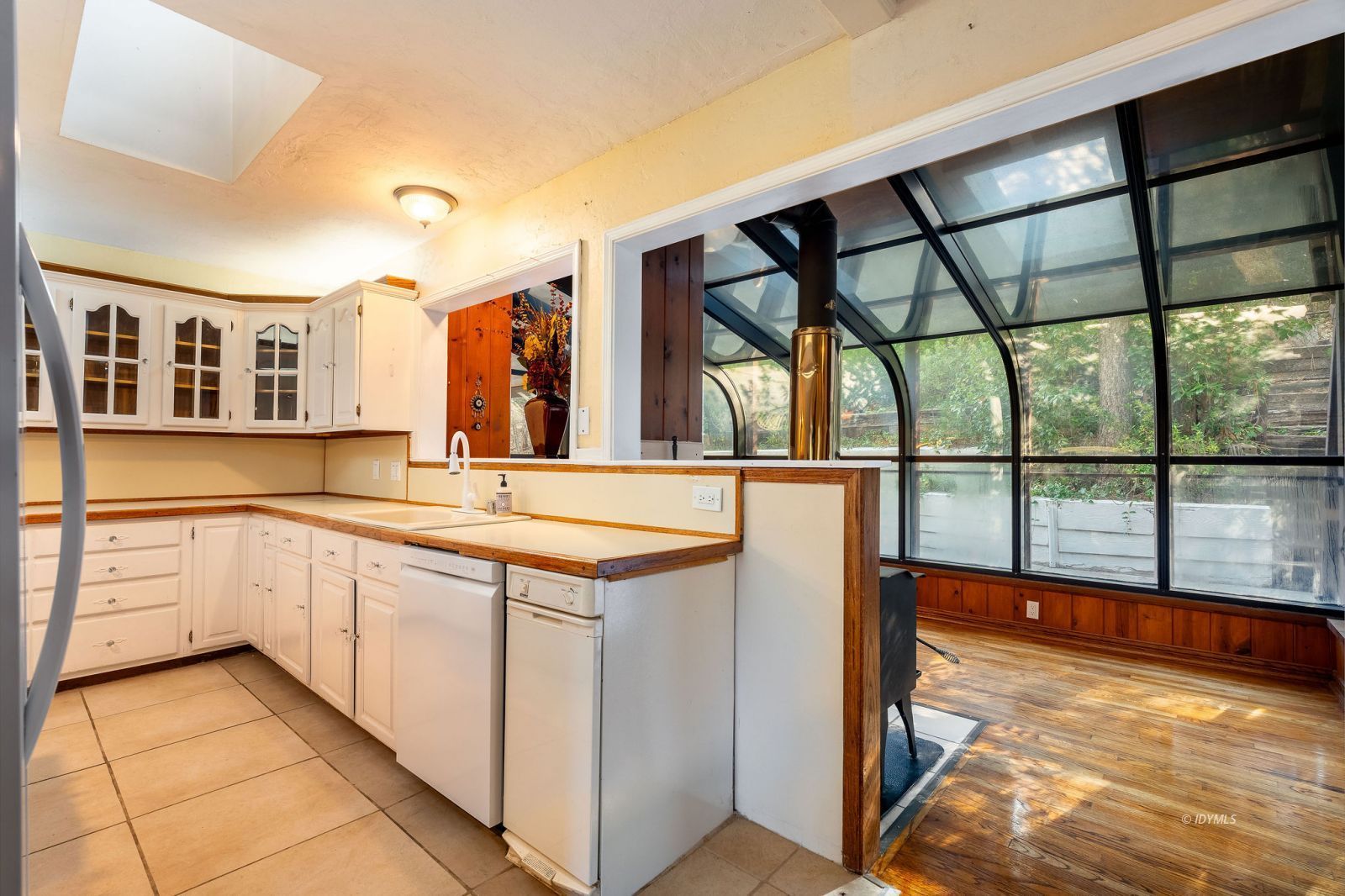 52805 Idyllmont Road Idyllwild, CA 92549 - Photo 13 of 53 a view of a large kitchen with a sink and windows