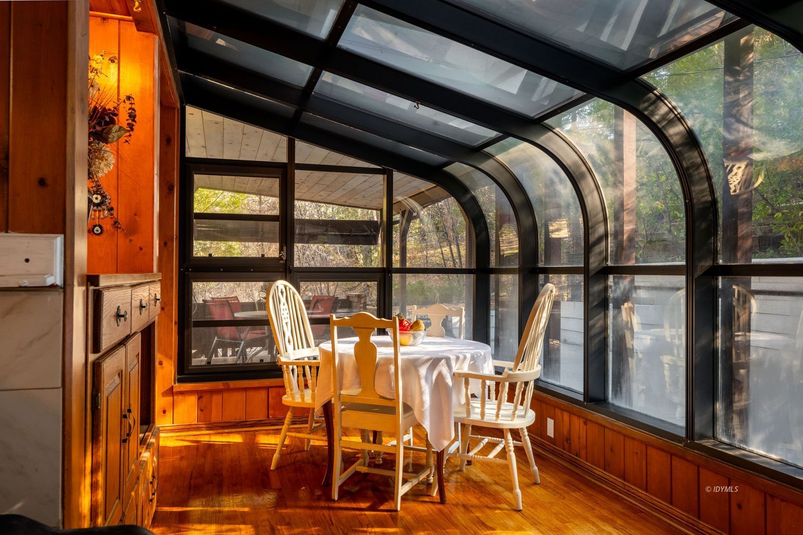 52805 Idyllmont Road Idyllwild, CA 92549 - Photo 18 of 53 a view of a dining room with furniture and floor to ceiling windows