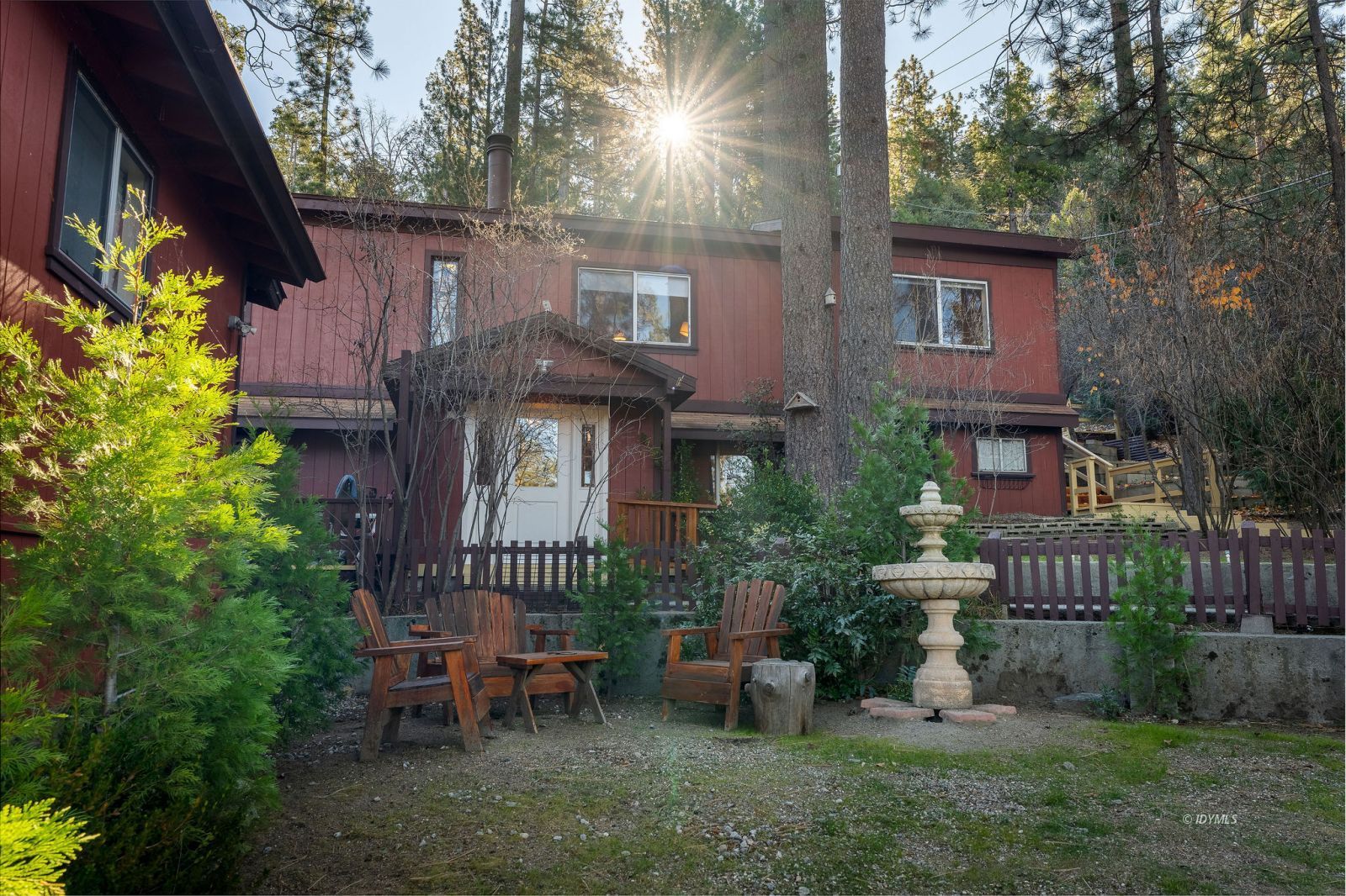 52805 Idyllmont Road Idyllwild, CA 92549 - Photo 36 of 53 a front view of a house with outdoor seating and a garden
