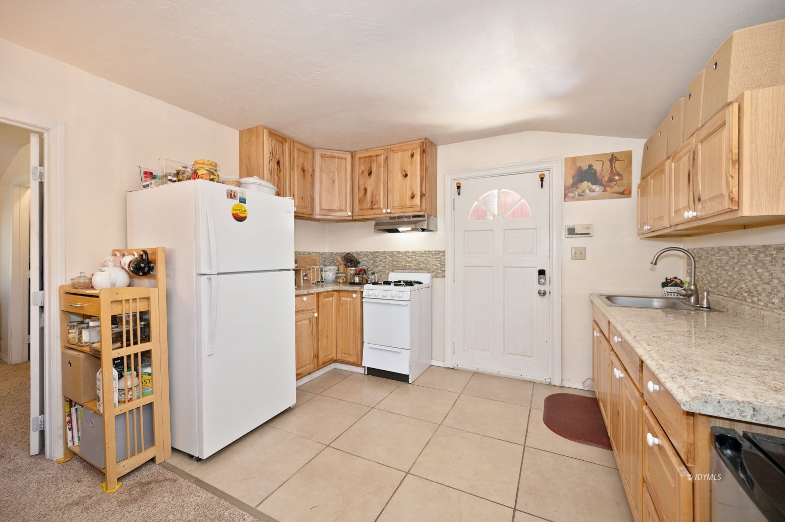 52805 Idyllmont Road Idyllwild, CA 92549 - Photo 52 of 52 a kitchen with a sink a refrigerator and cabinets