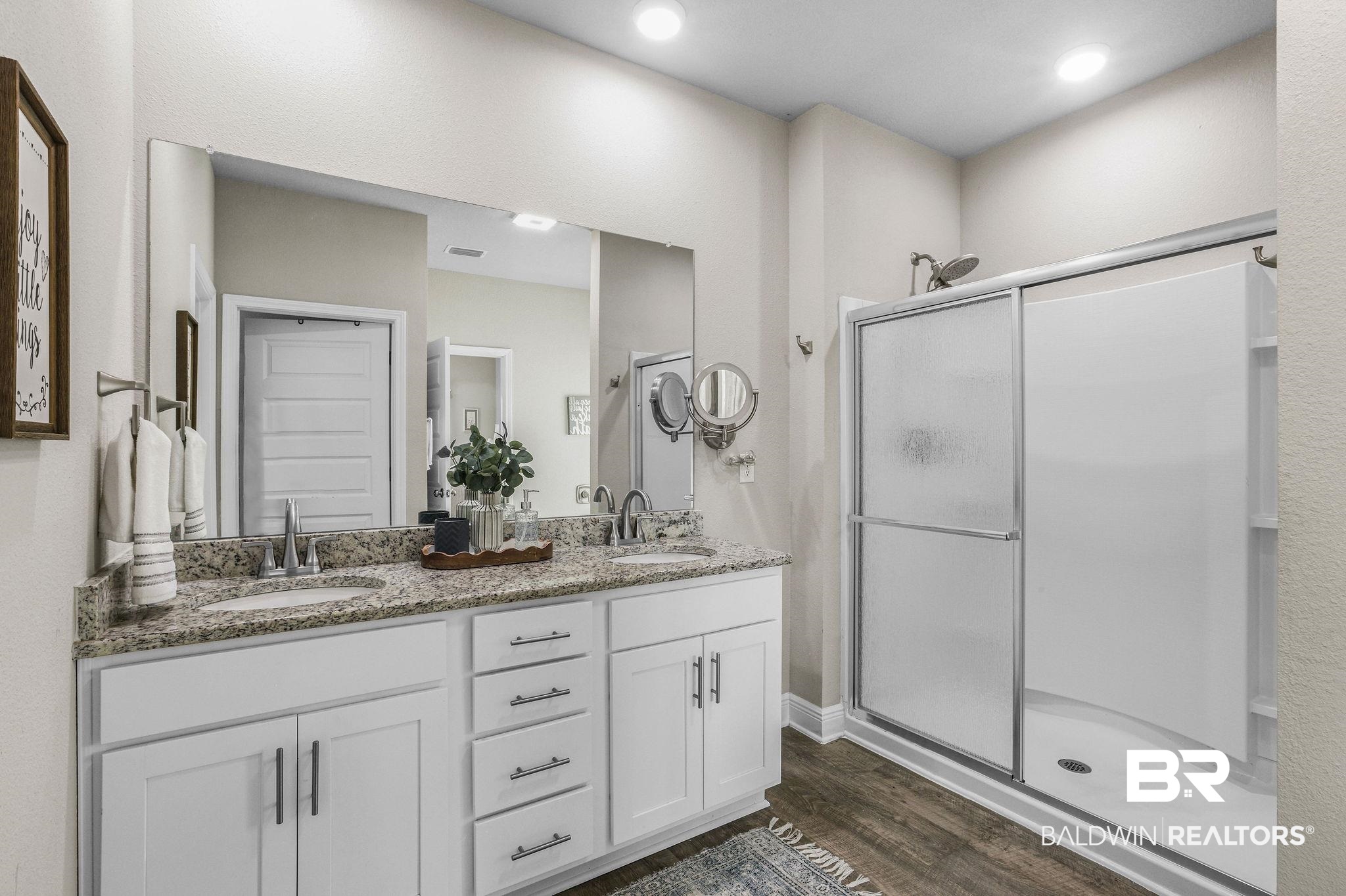 9056 Impala Drive Foley, AL 36535 - Photo 11 of 22 Bathroom with hardwood / wood-style flooring, vanity, and walk in shower