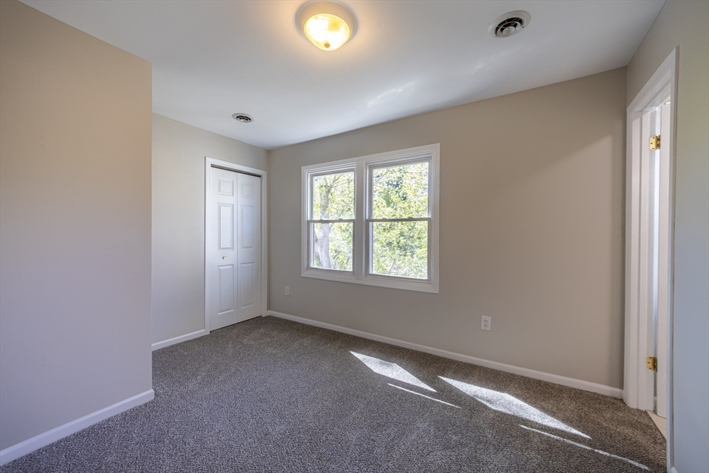 357 Boylston Street, Unit 3 Lowell, MA 01852 - Photo 14 of 35 an empty room with a empty space and windows