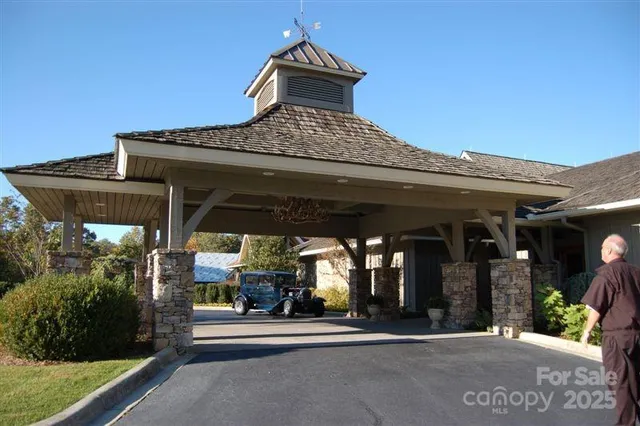 a view of house with river and outdoor space