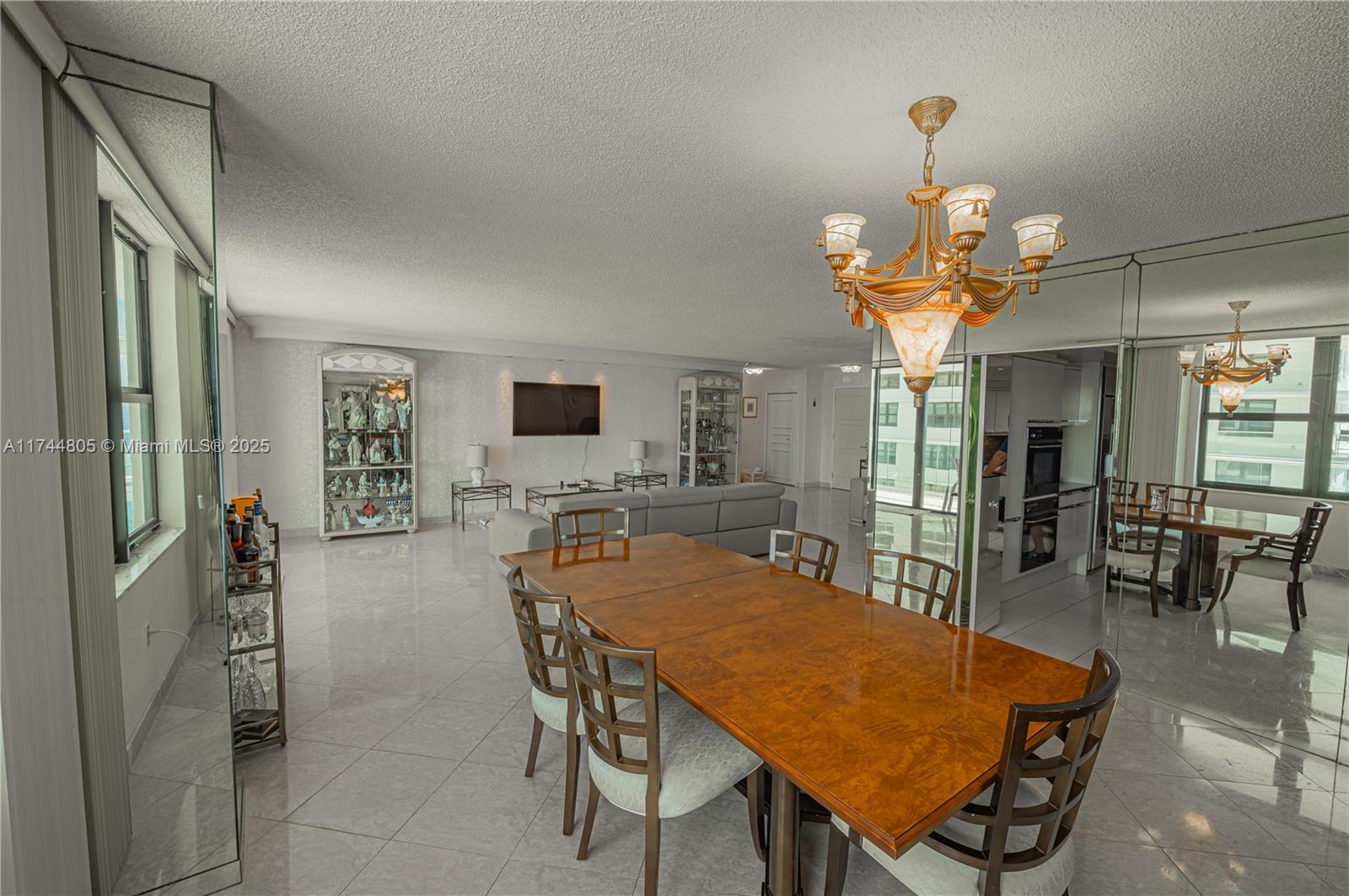 9801 Collins Avenue, Unit 14D Bal Harbour, FL 33154 - Photo 12 of 25 a view of a dining room with furniture