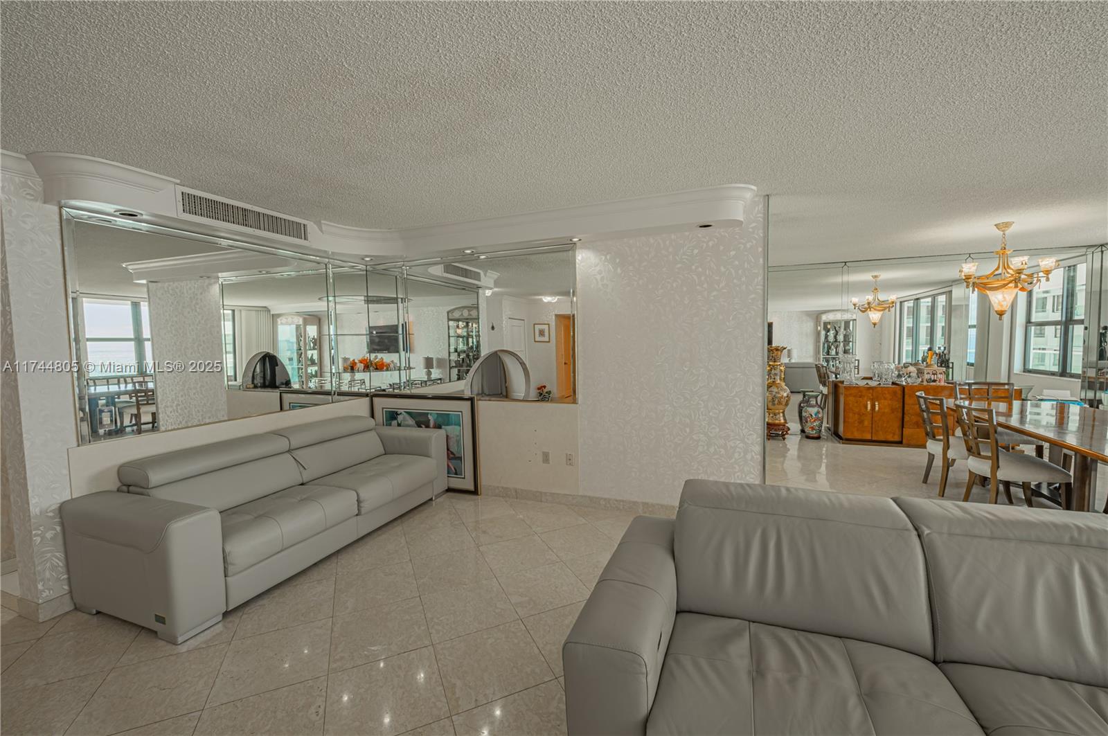 9801 Collins Avenue, Unit 14D Bal Harbour, FL 33154 - Photo 14 of 25 a living room with furniture and a view of kitchen