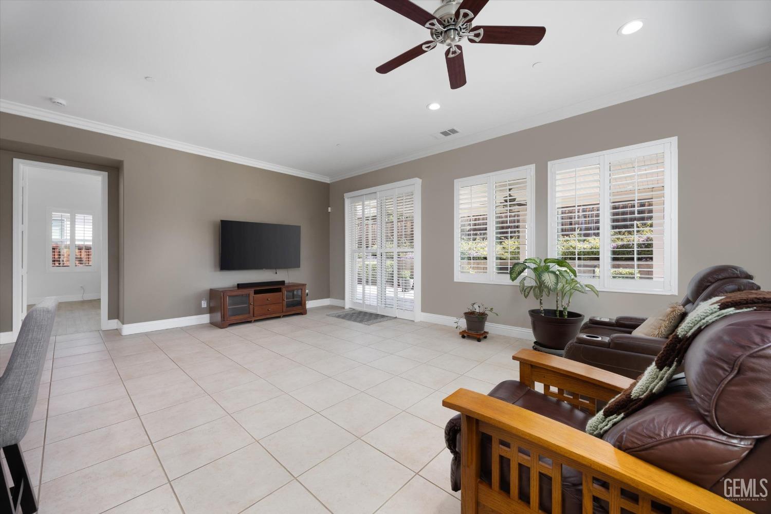 Undisclosed Address Bakersfield, CA 93306 - Photo 13 of 70 a living room with furniture and a flat screen tv