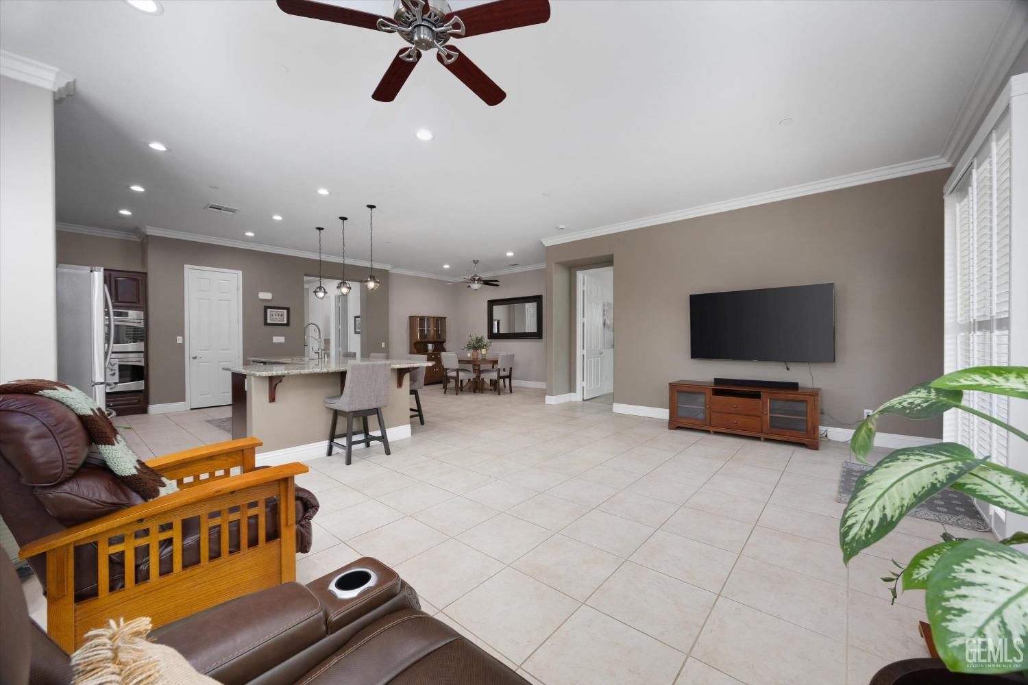 Undisclosed Address Bakersfield, CA 93306 - Photo 14 of 70 a living room with furniture and a flat screen tv