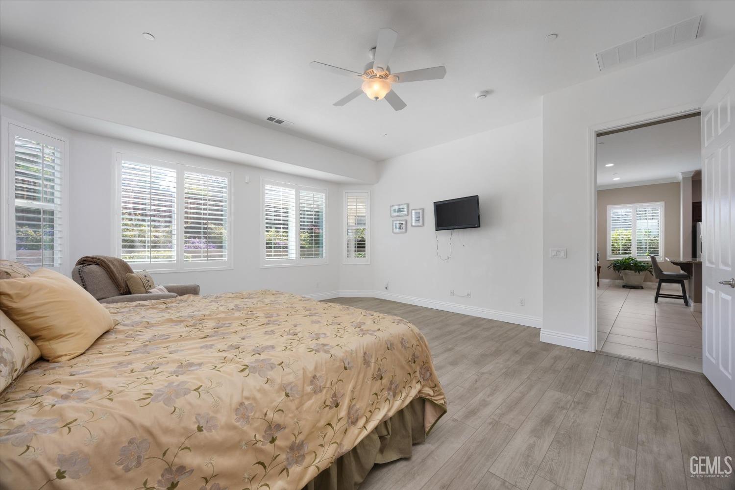 Undisclosed Address Bakersfield, CA 93306 - Photo 18 of 70 a bedroom with a large bed and a window