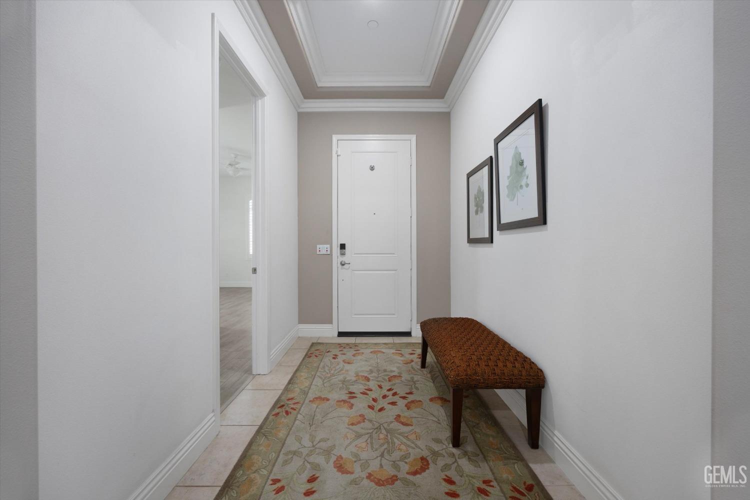 Undisclosed Address Bakersfield, CA 93306 - Photo 2 of 70 a view of a hallway with a chair and a door