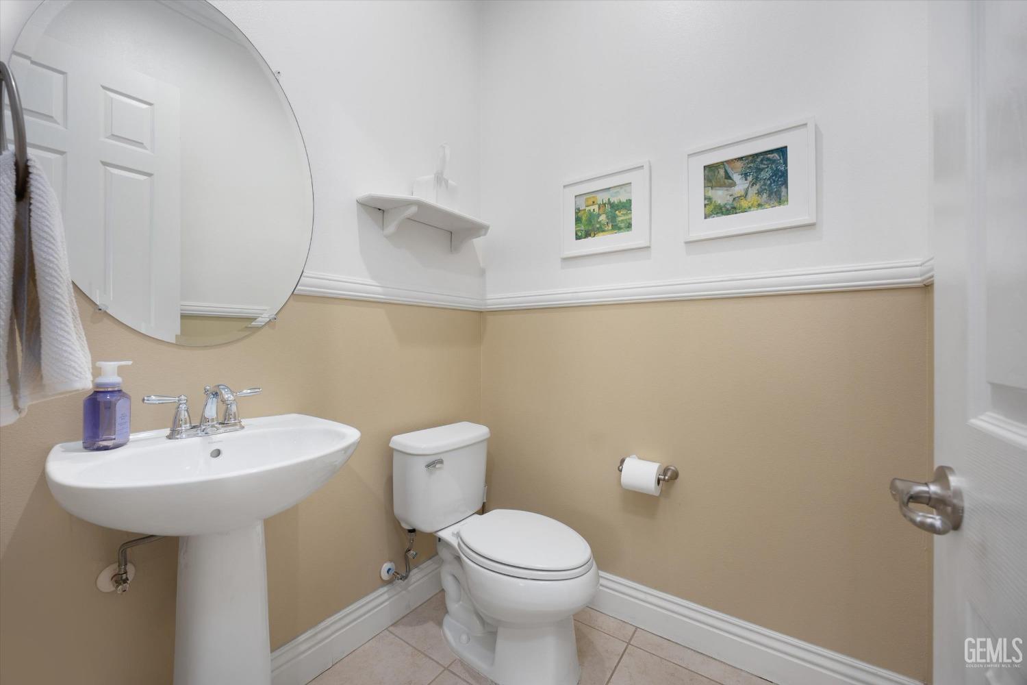 Undisclosed Address Bakersfield, CA 93306 - Photo 29 of 70 a bathroom with a sink mirror and toilet