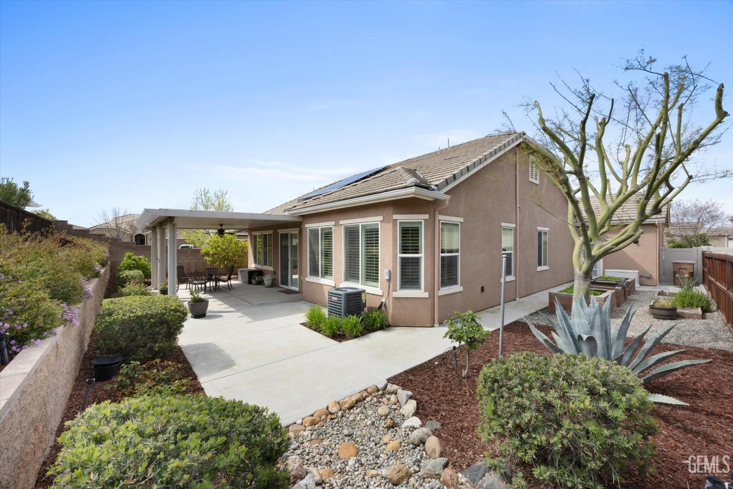 Undisclosed Address Bakersfield, CA 93306 - Photo 34 of 70 a view of a house with backyard sitting area and garden