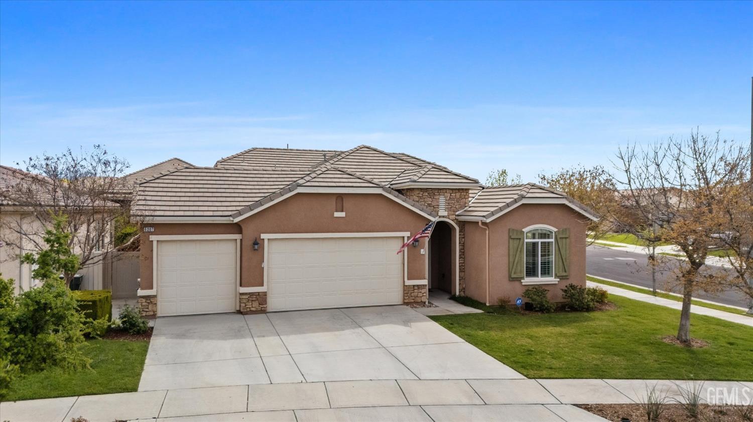 Undisclosed Address Bakersfield, CA 93306 - Photo 42 of 70 a front view of a house with a garden