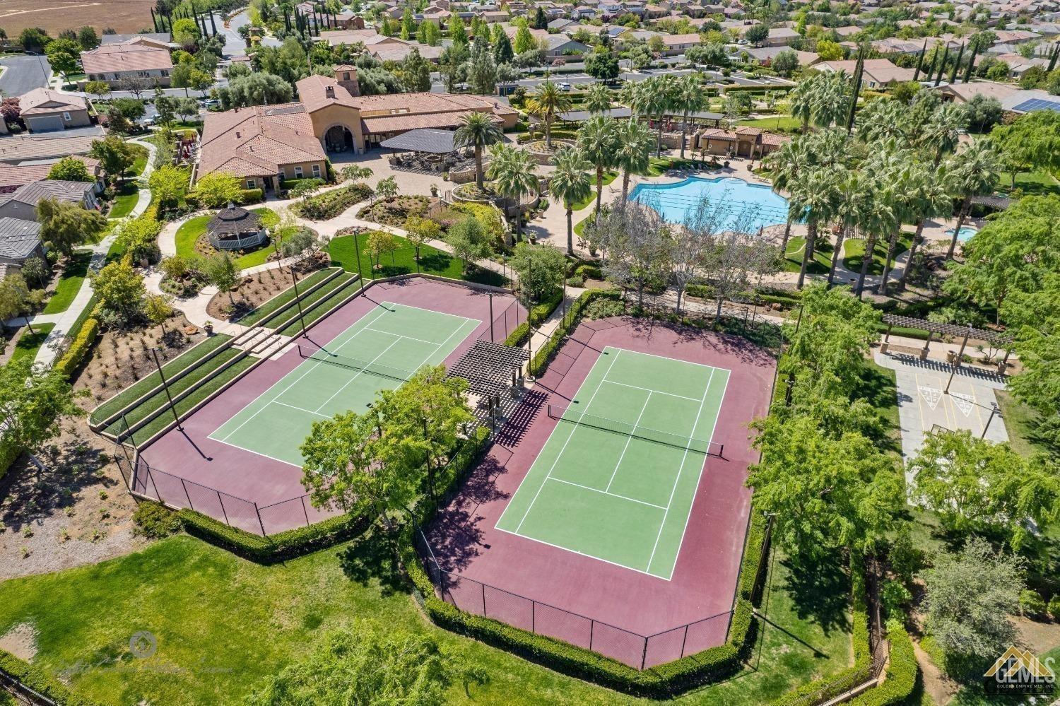 Undisclosed Address Bakersfield, CA 93306 - Photo 47 of 70 an aerial view of residential houses with outdoor space and street view