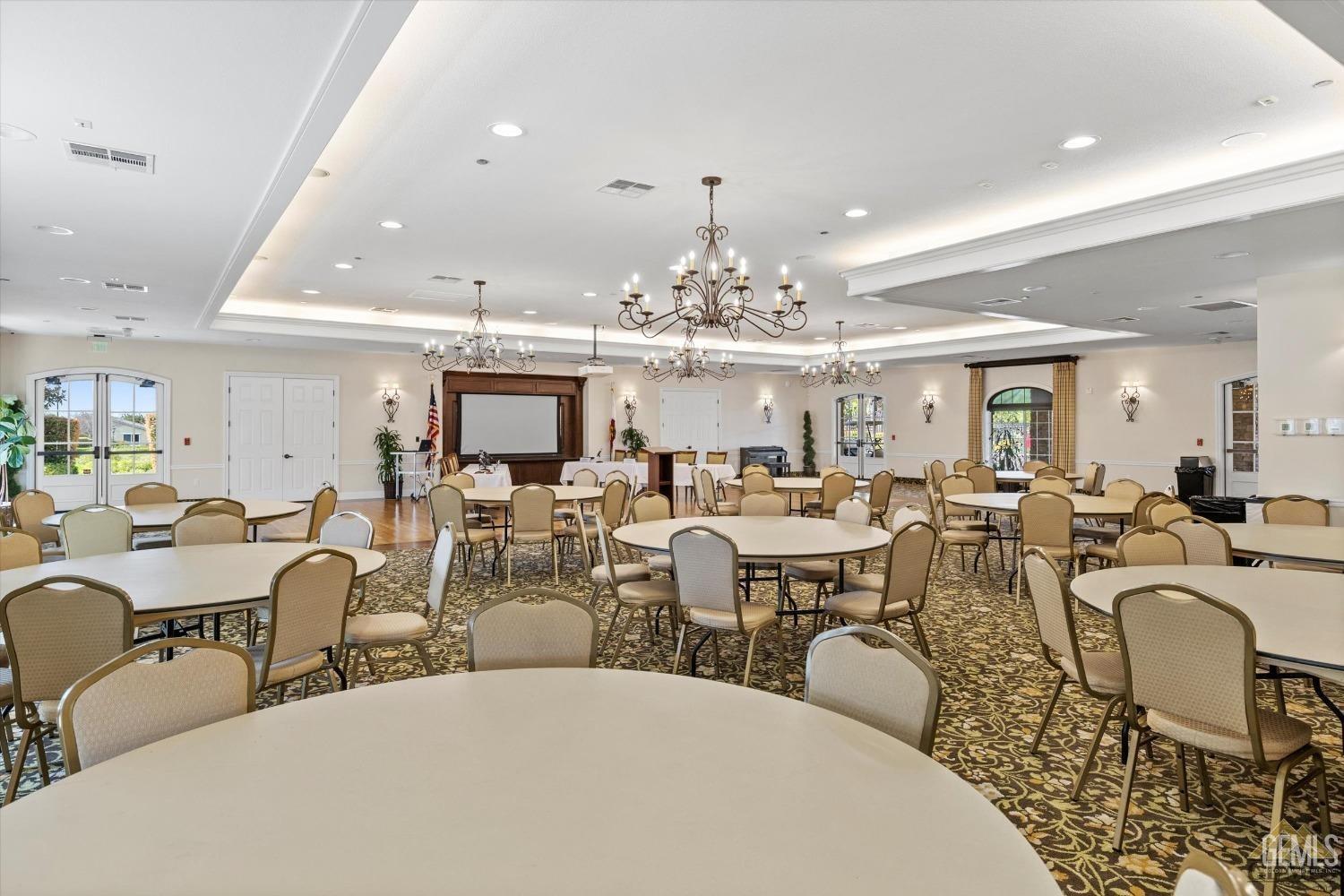 Undisclosed Address Bakersfield, CA 93306 - Photo 62 of 70 a very nice looking dining room with lots of white furniture and chandelier