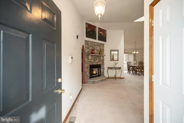 a living room with furniture ceiling fan and a rug