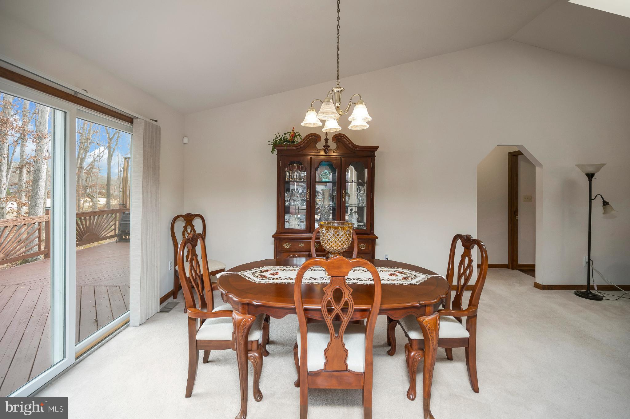 117 Green Street Locust Grove, VA 22508 - Photo 23 of 63 a dining room with furniture a chandelier and window