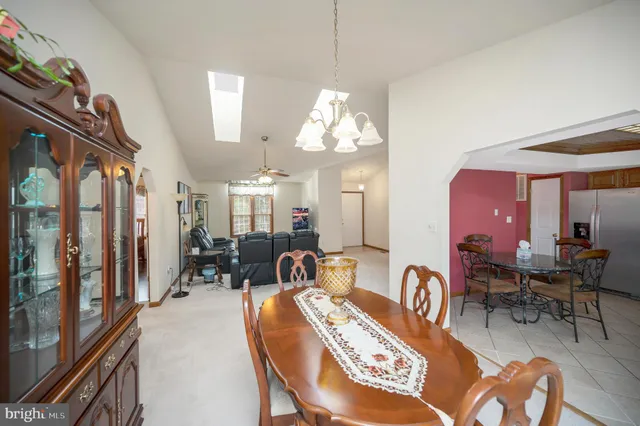 a kitchen with stainless steel appliances granite countertop a refrigerator stove and sink