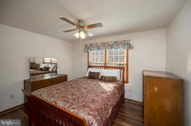 a view of a lake with outdoor seating space