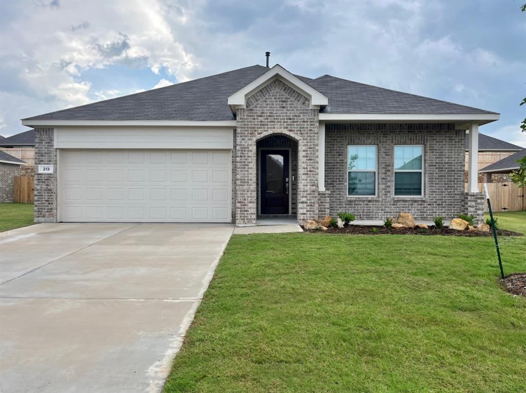 front view of a house with a yard