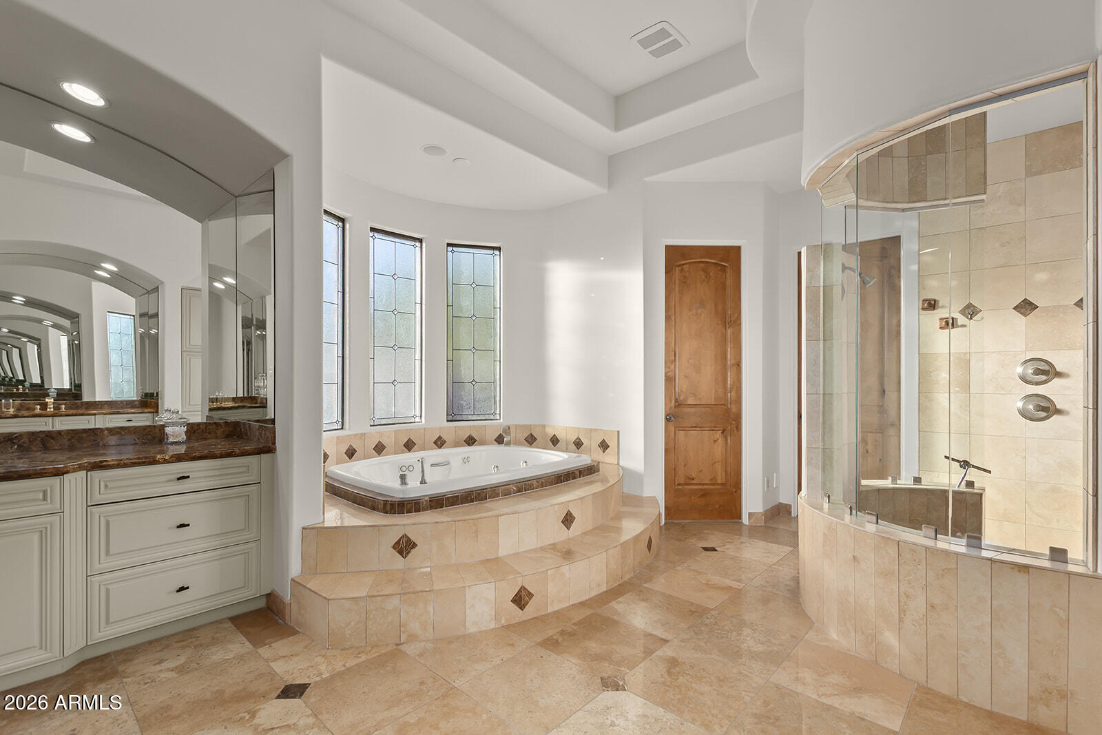 11861 East Desert Trail Road Scottsdale, AZ 85259 - Photo 23 of 63 a spacious bathroom with a granite countertop sink mirror and a bathtub