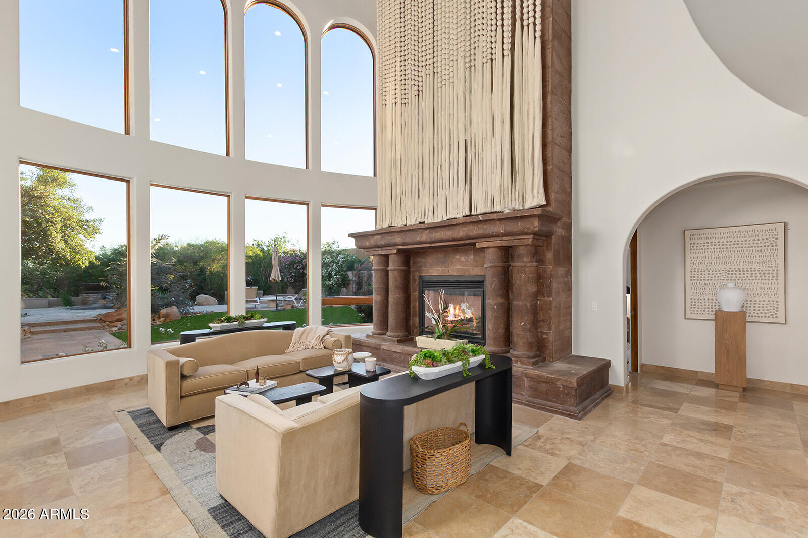 11861 East Desert Trail Road Scottsdale, AZ 85259 - Photo 27 of 63 a living room with fireplace furniture and a floor to ceiling window
