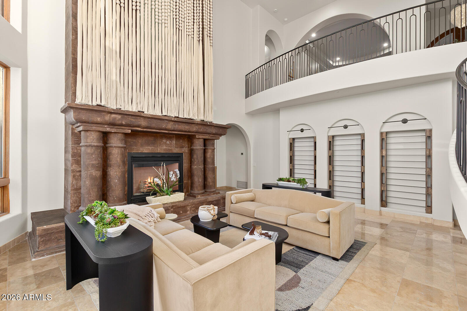 11861 East Desert Trail Road Scottsdale, AZ 85259 - Photo 29 of 63 a living room with furniture and a fireplace